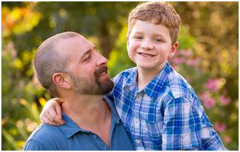 Phineas child cancer survivor with father