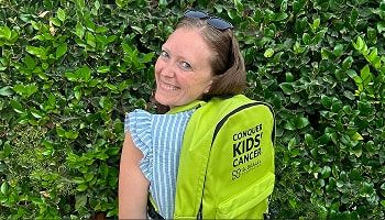 girl wearing a green backpack