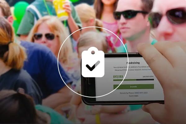 Volunteers promoting and recruiting for a St. Baldrick's fundraiser