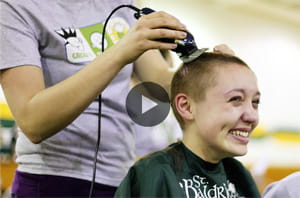 Young girl participating at head shaving event