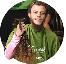 Individual rubbing back of their head after having it shaved