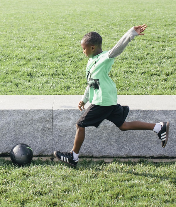 Harlem kicking a soccer ball