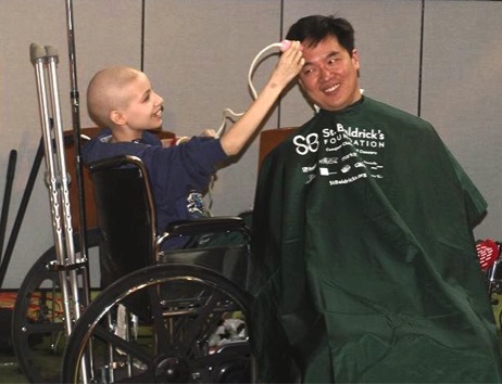 Honored Kid Kelly shaving Dr. Alex Huang's head