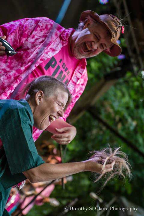 Peggy Davis shaving for St. Baldrick's onstage at Northwest String Summit