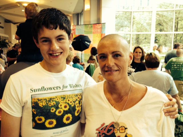 Leslie Jermainne and her son Brian after she shaved her head at the 46 Mommas head-shaving event in July