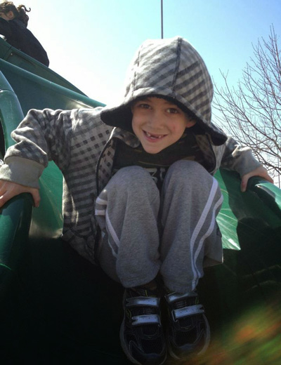 Superman Sam Sommer playing on a playground in April 2012