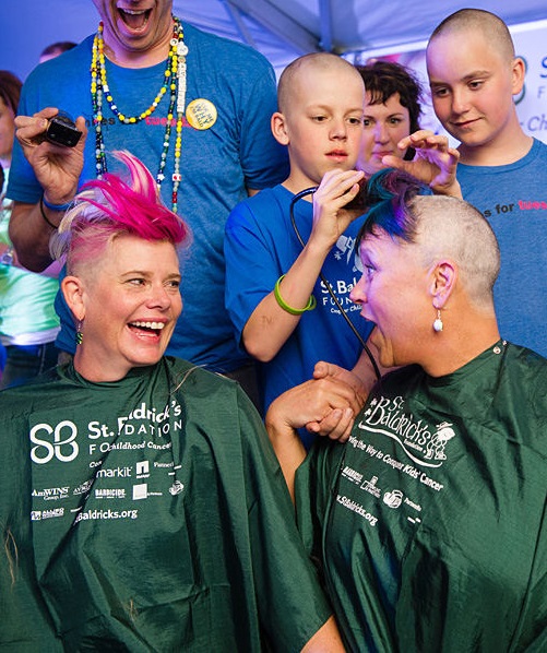 Laurie and a friend shaving their heads