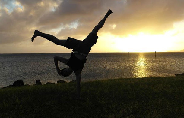 Dave breakdancing on a beach in Hawaii