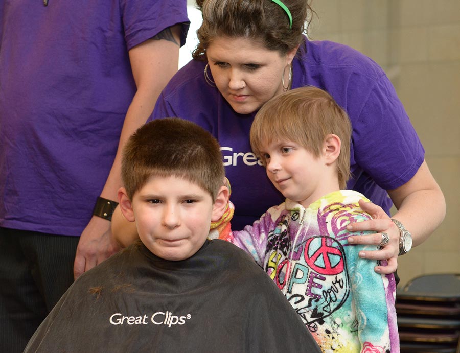 Emily shaved her brother's head for St. Baldrick's