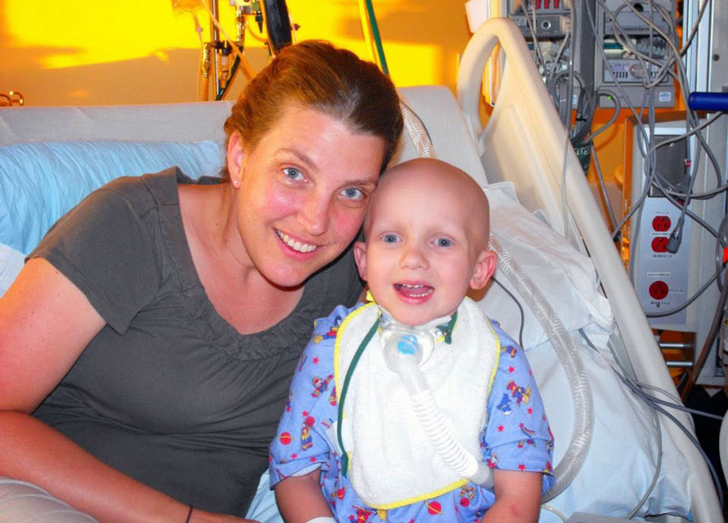 Israel with his mom, Lori, while he was in treatment for childhood cancer