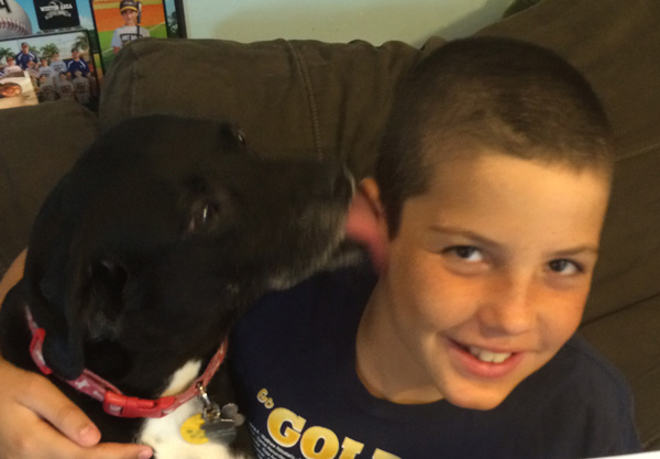 Josh with his beloved dog, Igor, a week after shaving for St. Baldrick's