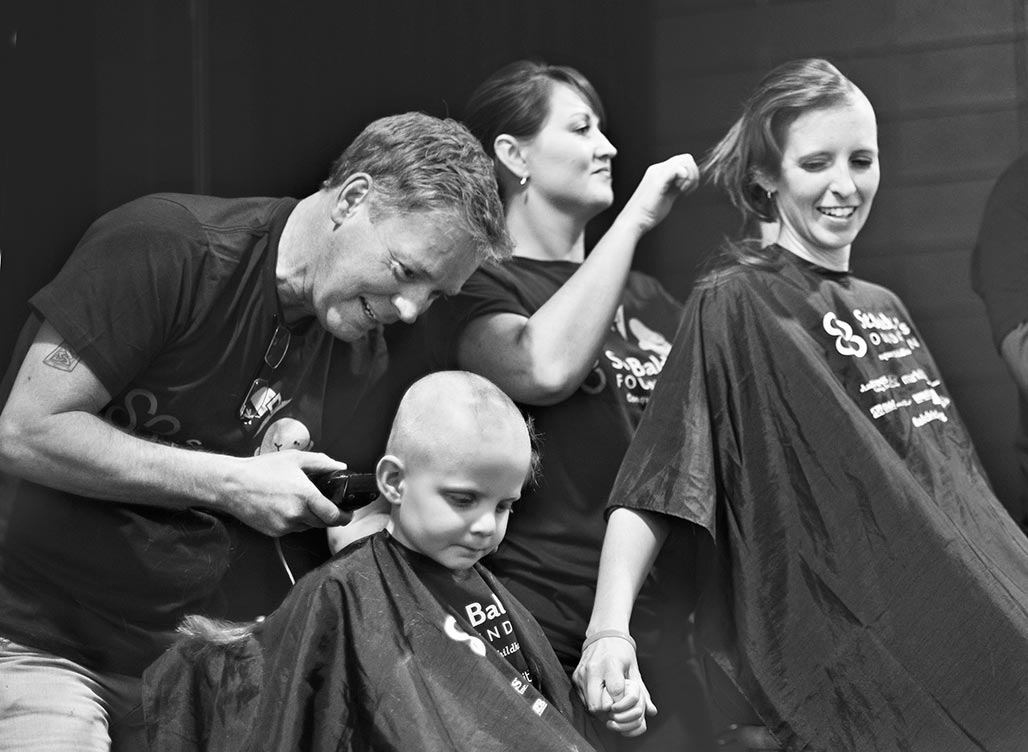 Matthias and Katie shaving heads for cancer