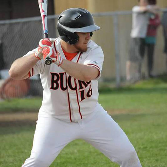 Daniel steps up to bat while playing baseball in high school.