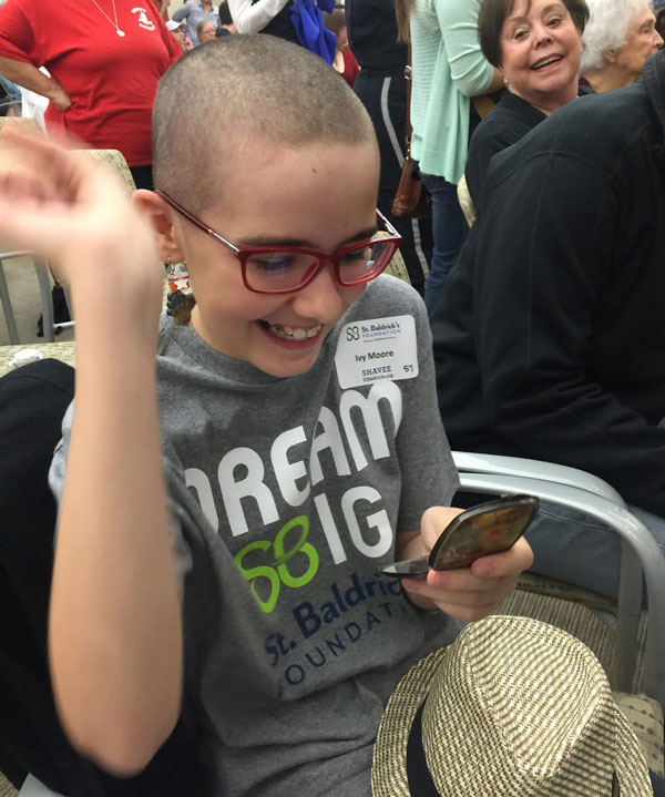 Ivy gets a first look at her bald, beautiful self.