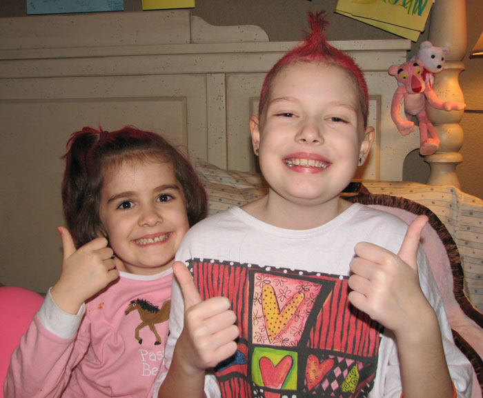 Ivy and Georgia pose together with Georgia's pink mohawk.