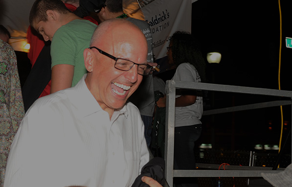 Congressman Deutch laughing as he walks off the stage