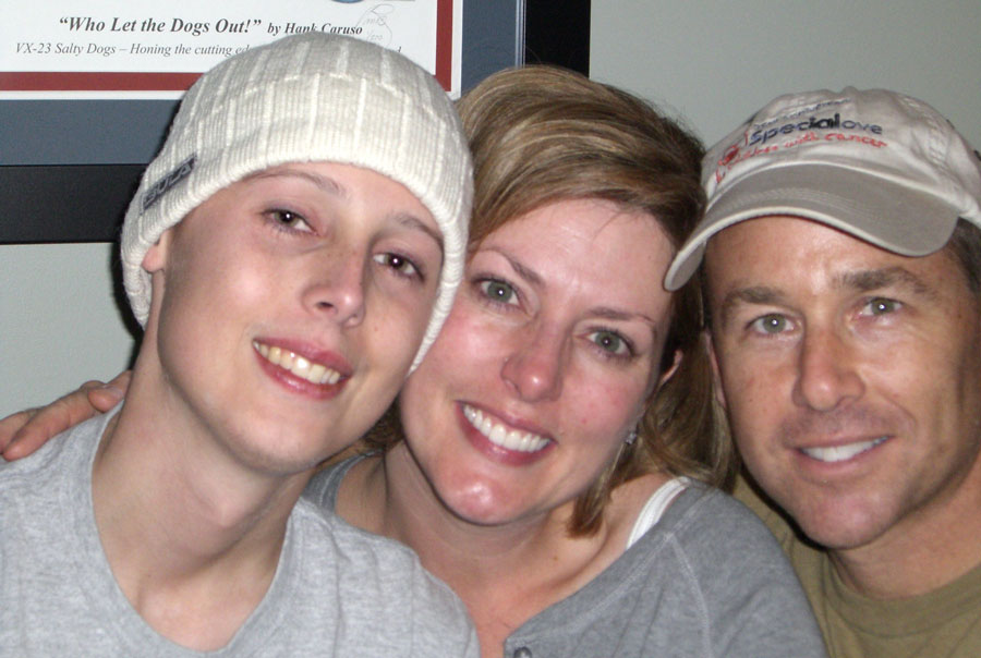 Jordan Paganelli, pictured with his parents, wearing a beanie