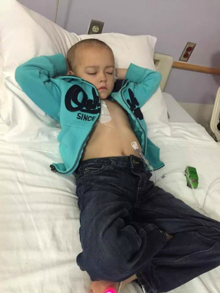 Carter rests on a hospital bed during his chemo