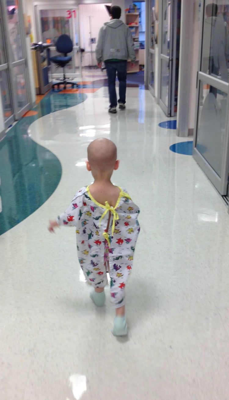 Roxie walks to the playroom at the hospital