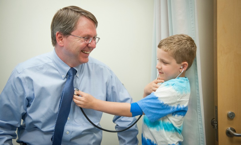 Phineas uses a stethoscope to examine Dr. Lee