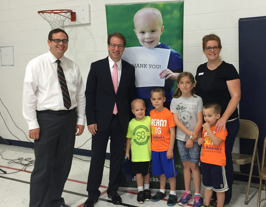 Representative Peter Roskam stands with the Ewoldts