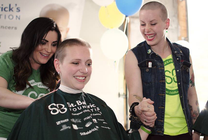 Ruth Daniels clasped hands with her sister the day they braved the shave together.