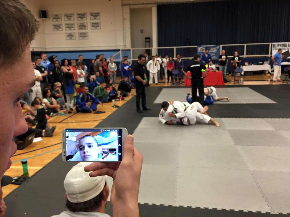 Isaac, who has acute lymphoblastic leukemia, watches his father compete in his honor in the Tap Cancer Out Winter BJJ Open