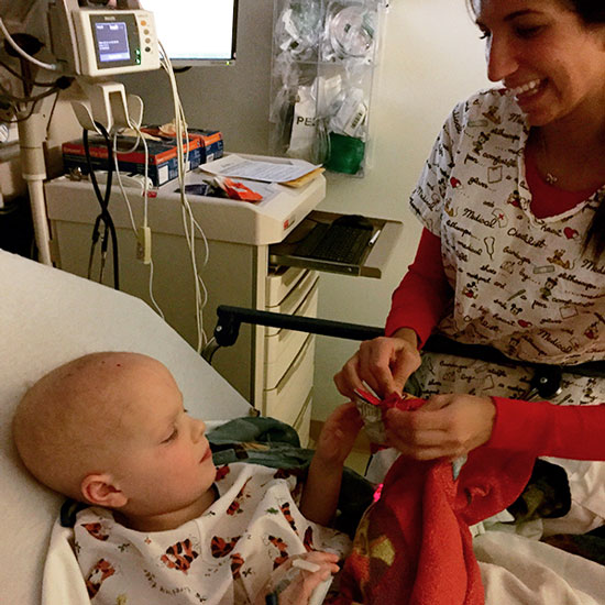 Chase getting a snack from a nurse after the MRI