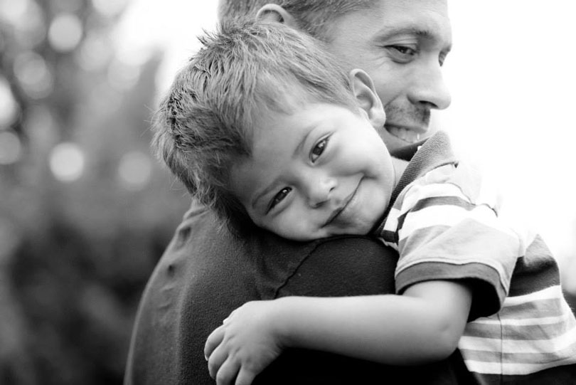 Ted holding his young son Sam