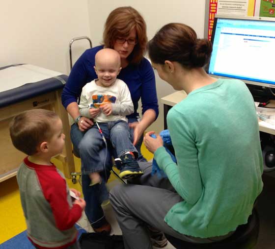 Aidan stands by and helps as Chase gets his blood drawn.