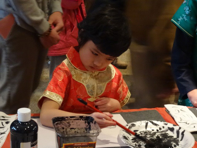 Daisy was the picture of fierce concentration as she painted a panda.