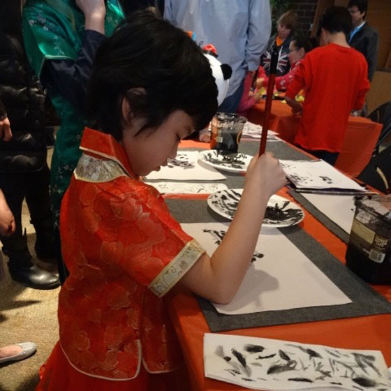 Daisy paints a panda during Chinese New Year.