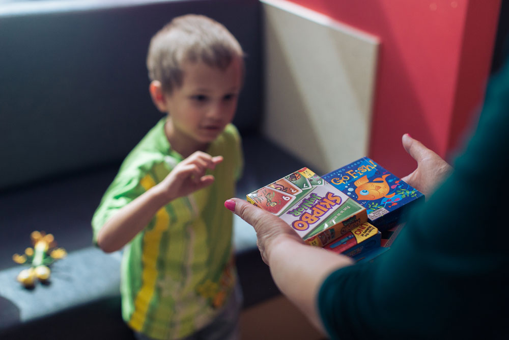 Micah picks out a game to play at the hospital