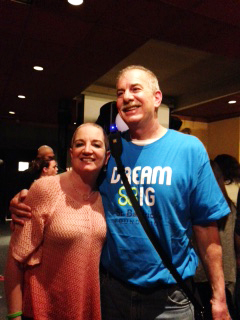 Ginny stands with her husband after their shave with St. Baldrick's.