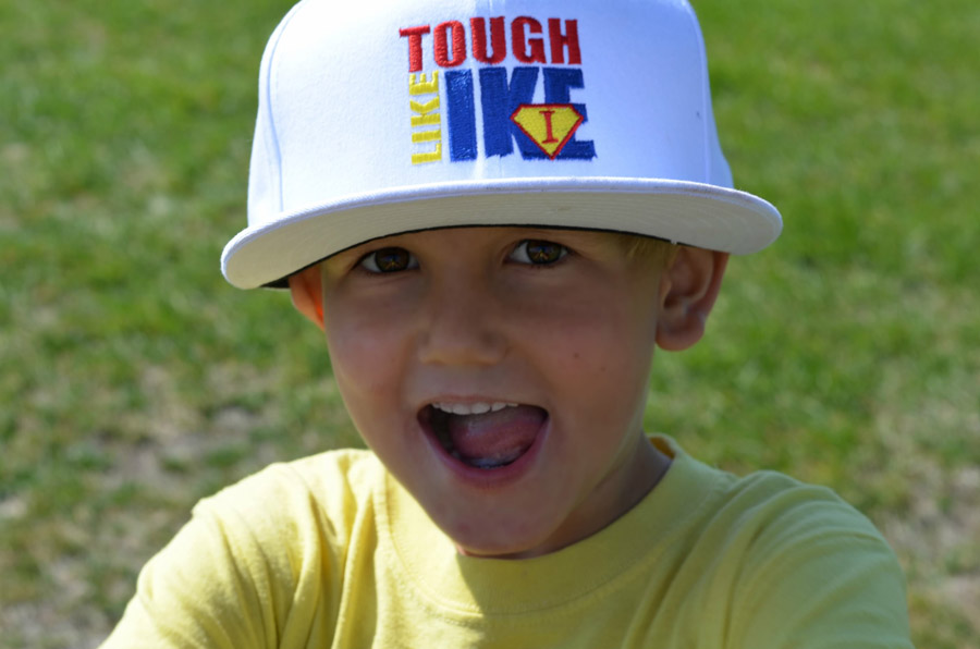 Isaac wearing a hat that reads 'Tough Like Ike'