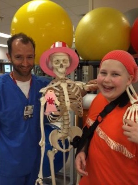 Alex and Caroline goofing around in the hospital