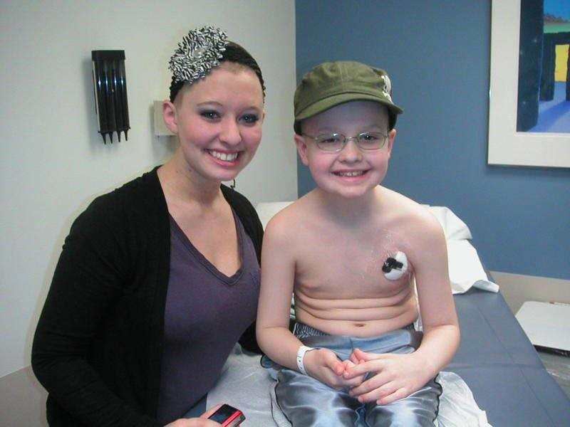 Taylor smiles with Josh in a doctor's office