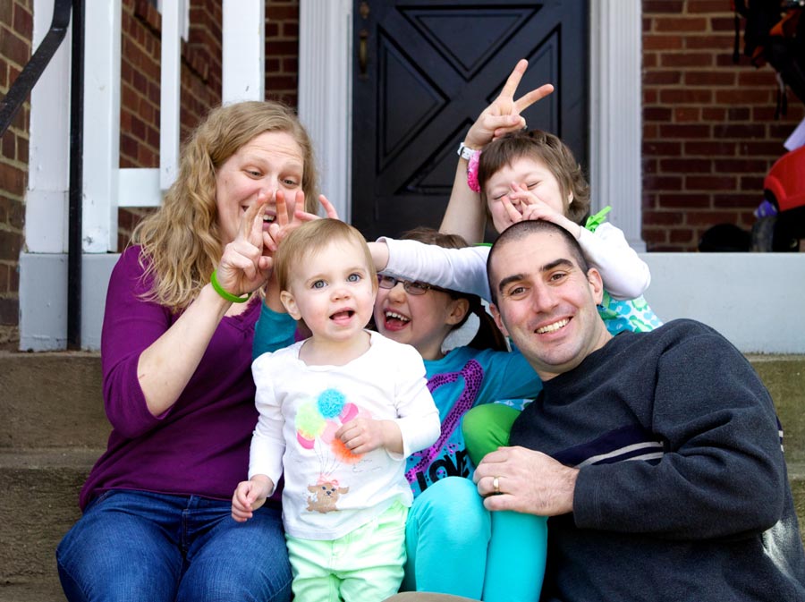 Abby, her sisters, and her parents having fun together