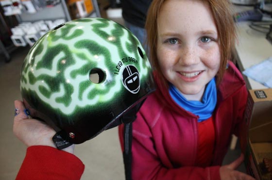 Grace smiles with her new bike helmet