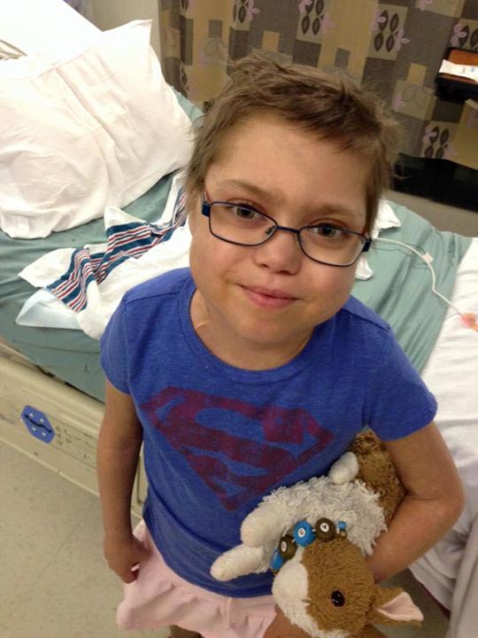 Abby holding her stuffed bunny