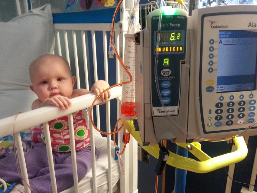 Baby Sally gets chemotherapy in a hospital crib