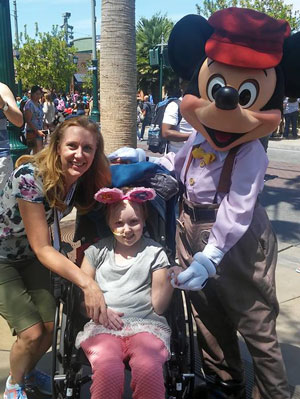 Avery and Stephanie hang out with Mickey Mouse