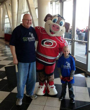 Caidan and Rick with the Carolina Hurricanes mascot