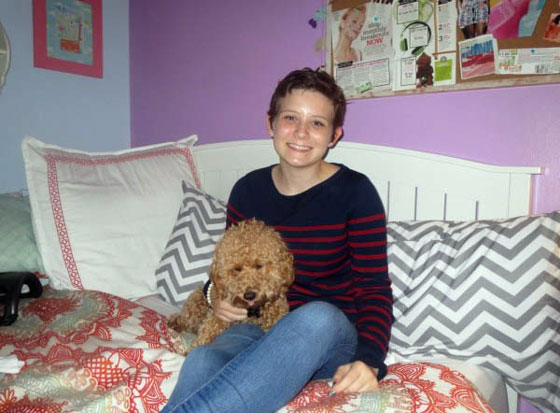 Cierra and her dog in her room