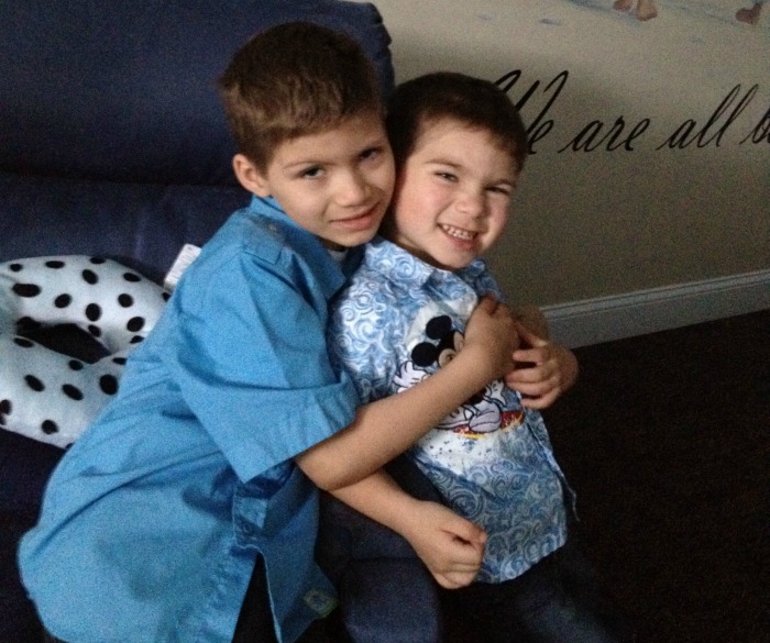 Julian and Brayden hug each other