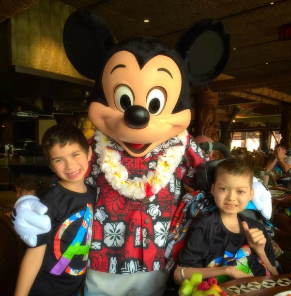 Brayden and Julian hang out with Mickey Mouse during Julian's Disney trip