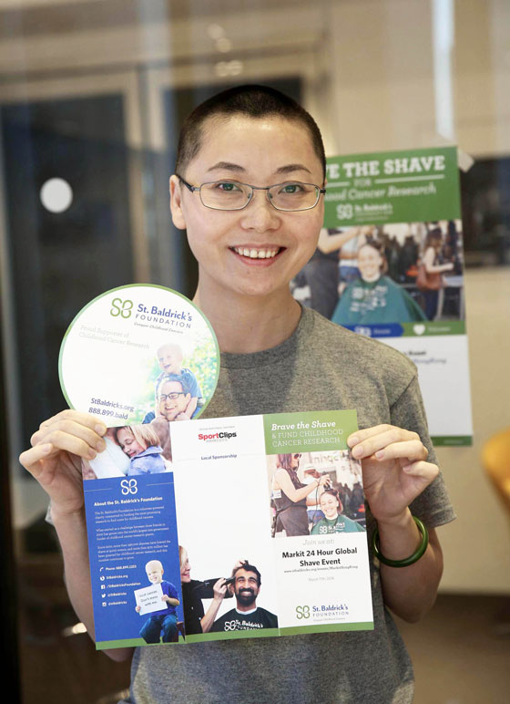 Shavee in Hong Kong holds St. Baldrick's brochure