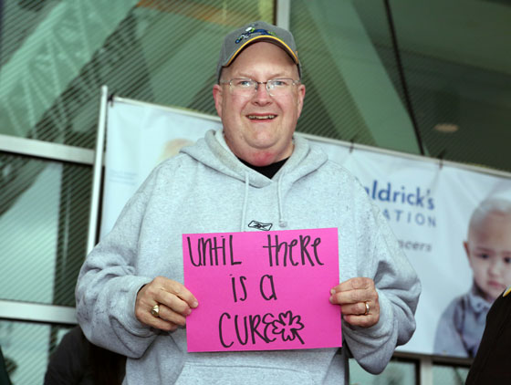 Rick holding his sign at the event