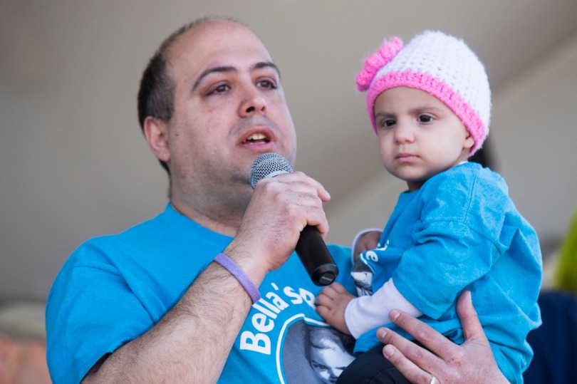 Isabella with her dad at a St. Baldrick's event