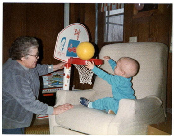 Baby Andrew playing basketball with his grandma